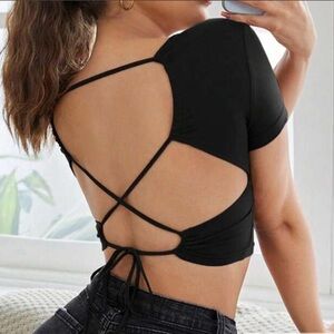 Black crop top with open back and tie details
NEVER WORN
